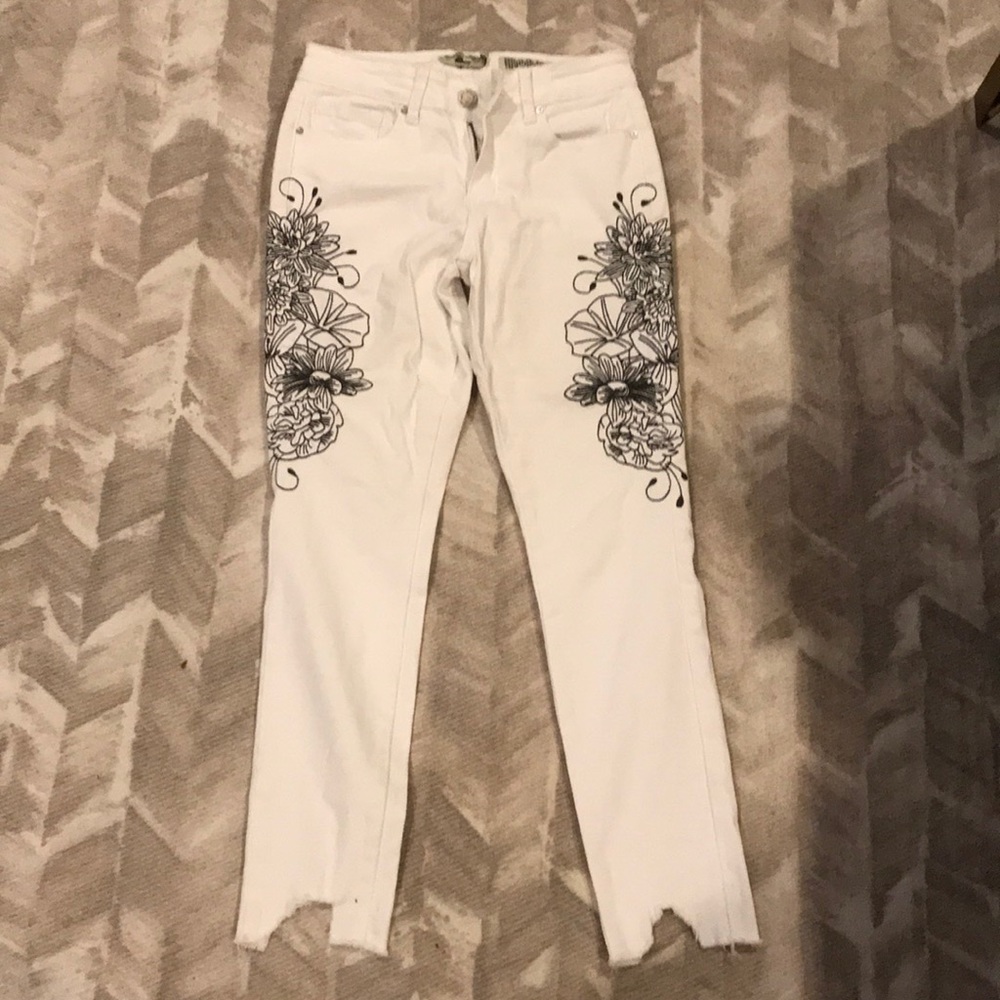 White jeans with embroidered detail